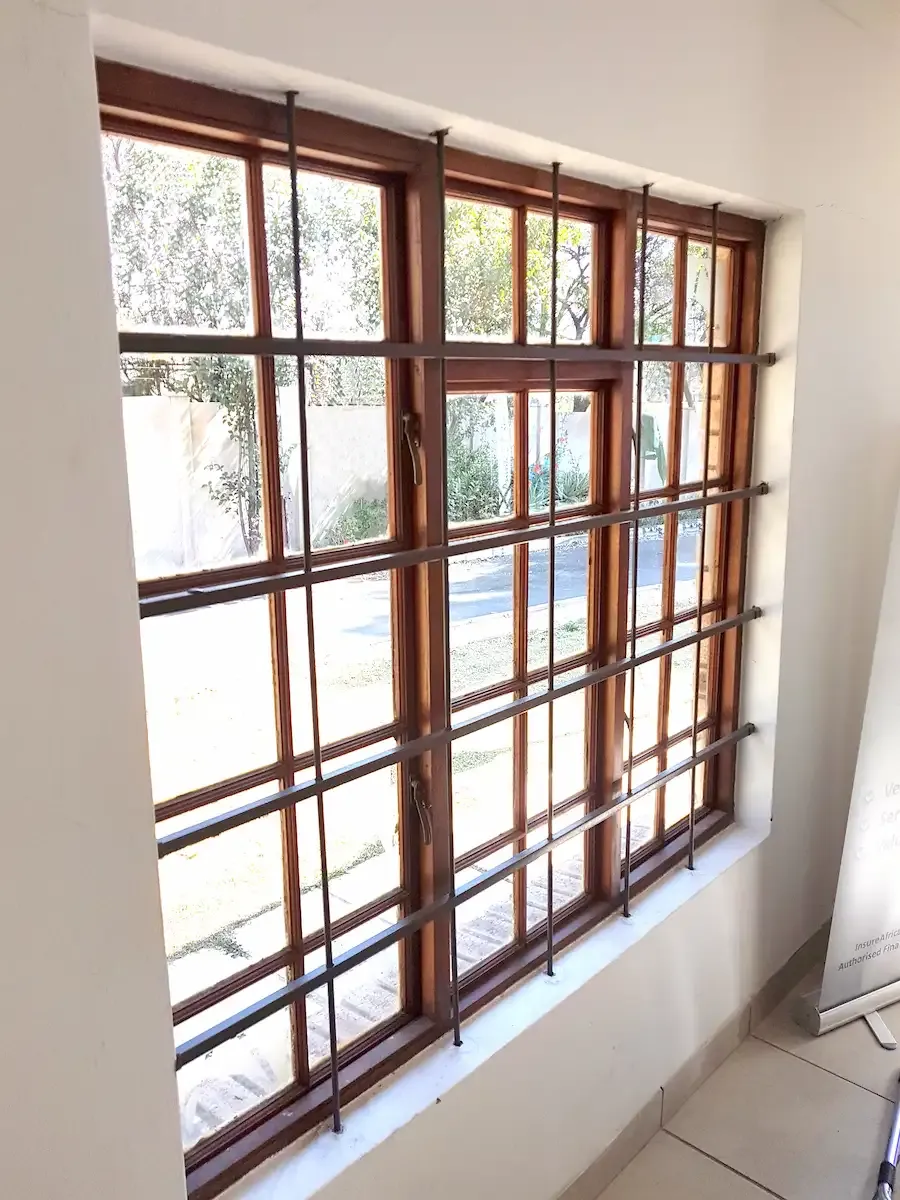 Cottage pane burglar bar installation.