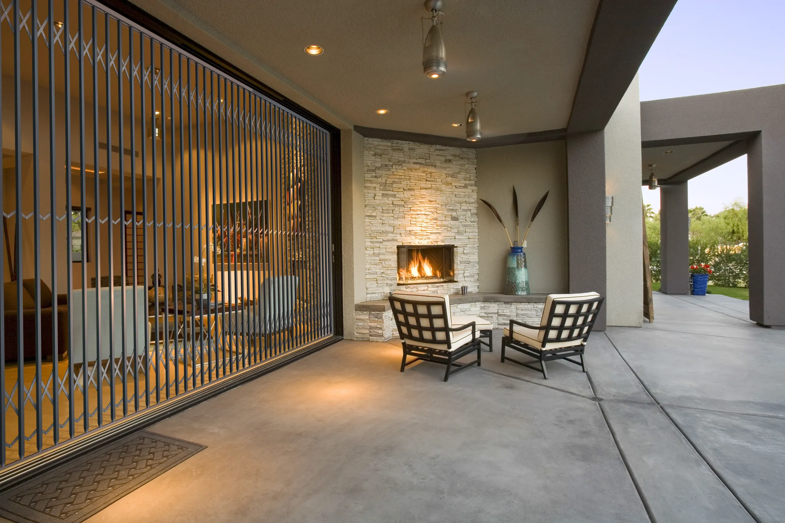A retractable trellis security gate fitted across an opening.