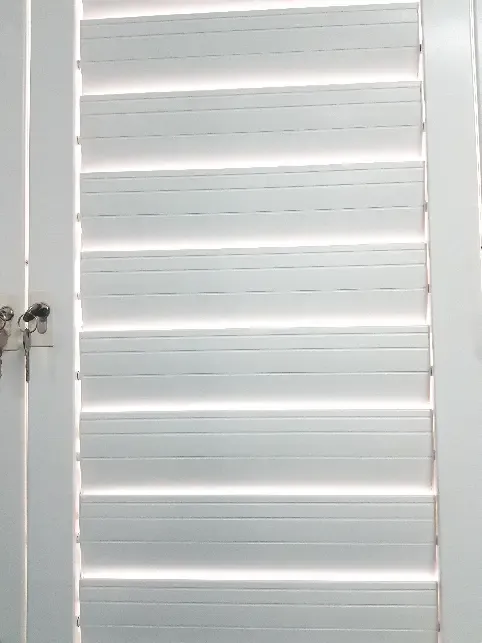 Louvre shutters fitted to a window or doorway.
