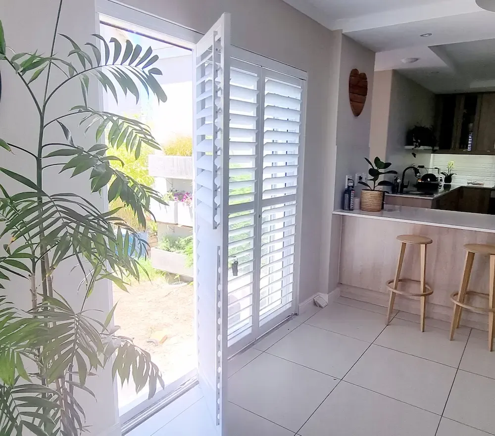Louvre shutters fitted to a window or doorway.