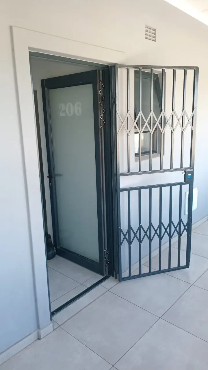 Hinged swing gate fitted to an entrance.